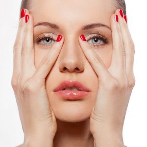 closeup woman portrait with hands on faec