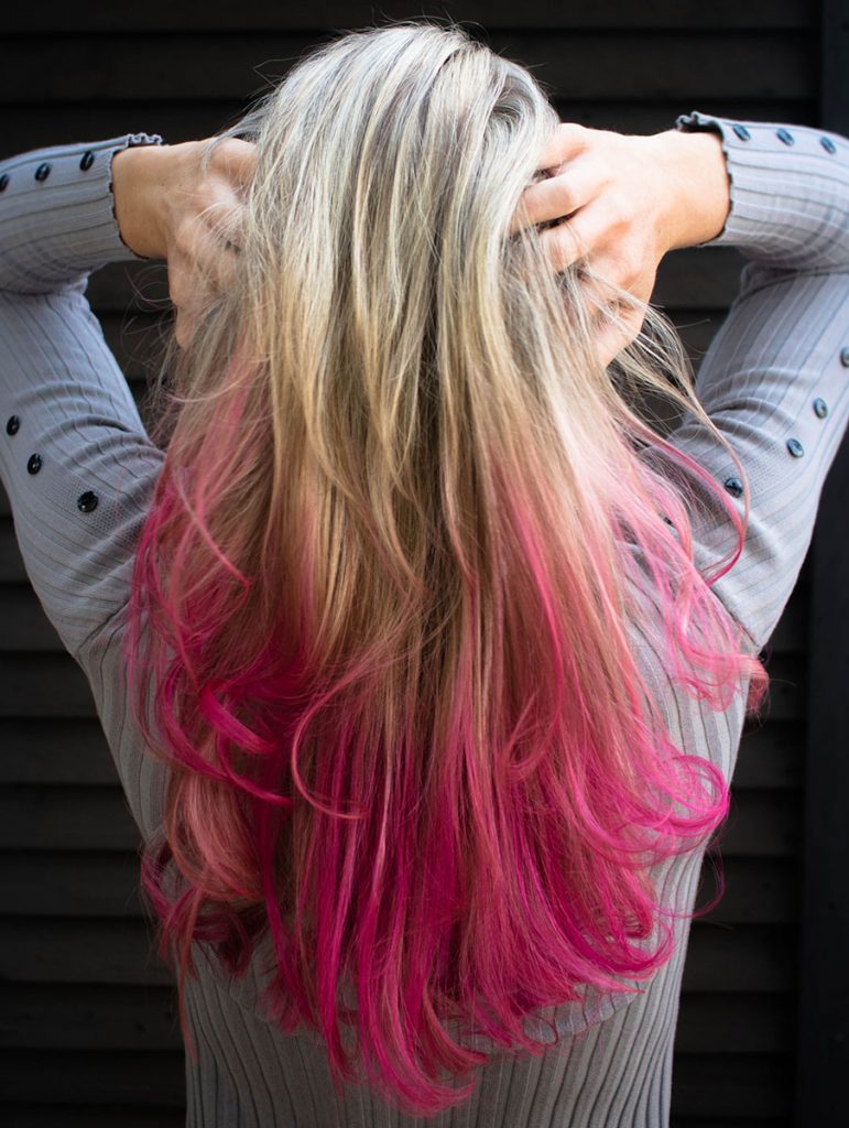 woman-in-gray-long-sleeved-top-holding-hair-1321916